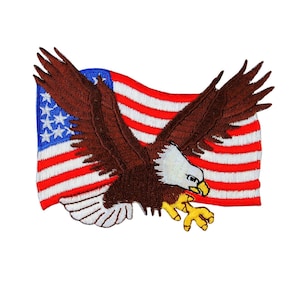 May include: An embroidered patch featuring a bald eagle flying in front of a waving American flag. The eagle is brown with a white head and yellow talons. The flag is red, white, and blue.