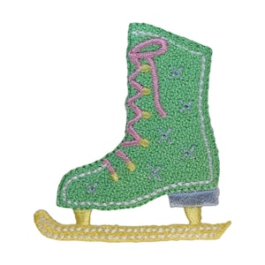 May include: Embroidered patch of a green ice skate with pink laces and yellow accents. The skate blade is yellow, and the boot features small embroidered stars. A charming, decorative patch.