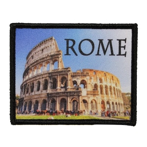 May include: A black and white embroidered patch with a colorful image of the Colosseum in Rome, Italy. The text "ROME" is printed in black above the image.