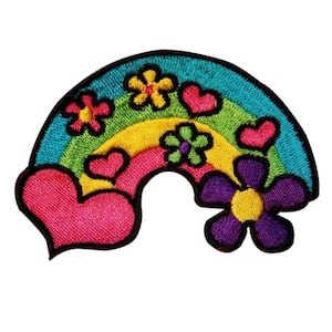 May include: A colorful rainbow patch with embroidered flowers and hearts. The rainbow is made of red, orange, yellow, green, blue, and purple. The flowers are yellow, green, and purple. The hearts are red.