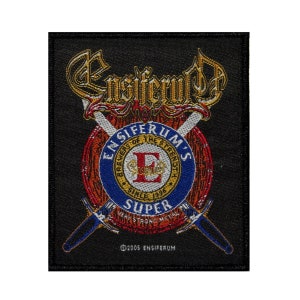May include: Black patch with a gold and red logo for the band Ensiferum. The logo features a crest with a large "E" and the text "Ensiferum's Brewery of the Strength Since 1996" and "Super Very Strong Metal". Two crossed swords are behind the crest.