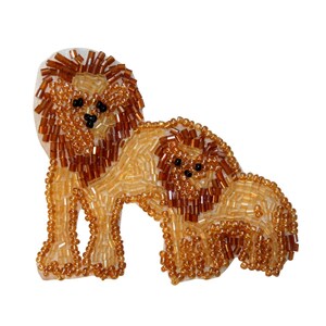 May include: A beaded lion and cub applique with a brown and gold color scheme. The lion and cub are facing forward with their heads turned slightly to the side. The applique is made of small, round beads that are sewn together to create the shape of the animals.