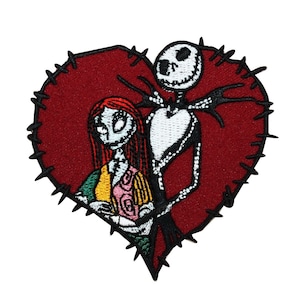 May include: Embroidered patch featuring Jack Skellington and Sally from The Nightmare Before Christmas. They are standing inside a red heart with black stitching around the edges.