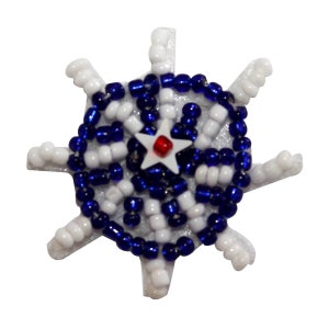 May include: A white and blue beaded snowflake ornament with a red star in the center.
