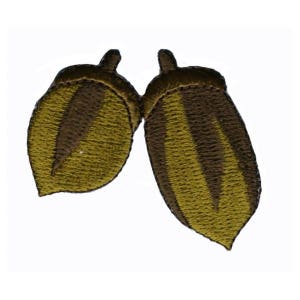 May include: Two brown and yellow embroidered acorn patches.