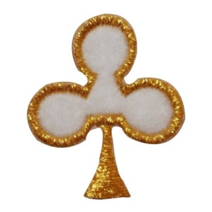 May include: A gold embroidered patch with a white felt clover design. The clover has three leaves and a stem.