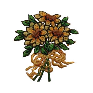 May include: A bouquet of embroidered yellow sunflowers with green leaves and a gold ribbon bow.