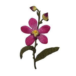 May include: A pink orchid flower with a yellow center and green leaves. The flower is embroidered and has a detailed design.