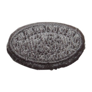 May include: A gray oval-shaped embroidered patch with a white outline.
