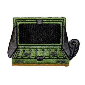 May include: Green and black embroidered patch depicting an open ammo box with a hinged lid and a handle. The box has a series of compartments inside.