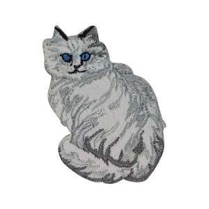 May include: A white and gray embroidered iron-on patch of a fluffy white cat with blue eyes.