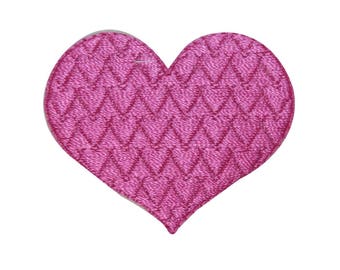 May include: A pink heart-shaped patch with a chevron pattern.