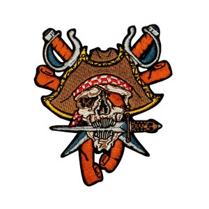 May include: Embroidered patch featuring a skull wearing a brown pirate hat with a red and white bandana, holding two crossed swords with orange and blue accents.