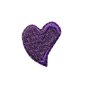 May include: A small purple heart-shaped patch. The patch is made of a soft, textured fabric.