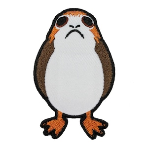 May include: A white, brown, and orange embroidered patch of a character from Star Wars. The character has large eyes, a small beak, and a round body.