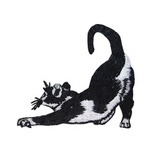 May include: Black and white embroidered iron-on patch of a cat stretching. The cat is in a playful pose with its tail curled over its back.