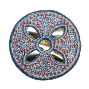 May include: A round blue denim patch with a red embroidered cross design. The cross has a silver reflective center and four silver reflective points.