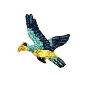 May include: Embroidered patch of a bird in flight. The bird features a yellow beak, a turquoise chest, and wings with a pattern of dark blue and turquoise. The patch is designed to be sewn onto fabric.