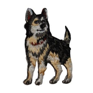 May include: Embroidered patch of a black and tan dog with a white chest. The dog is standing with its head turned to the side and its tail curled.