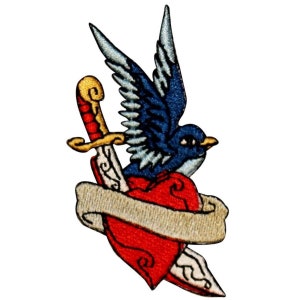 May include: A blue bird flies through the air, piercing a red heart with a gold-handled dagger. A white banner wraps around the heart and dagger.