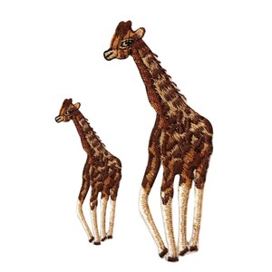 May include: Two embroidered iron-on patches of giraffes. The larger giraffe is brown with a light brown pattern and has a long neck and legs. The smaller giraffe is brown with a light brown pattern and has a shorter neck and legs.