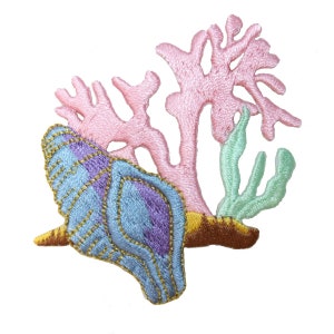 May include: Embroidered patch featuring a seashell with blue and purple details, accented with gold stitching. Pink coral and green seaweed are also present. The patch is designed with a nautical theme.