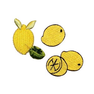 May include: Four embroidered iron-on patches of lemons. One whole lemon, one lemon slice, and two half lemons.