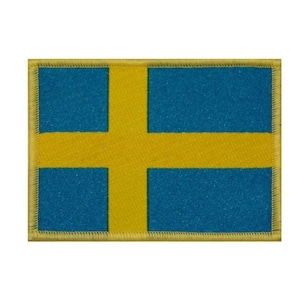 May include: A yellow and blue embroidered patch featuring the flag of Sweden. The flag has a yellow cross on a blue background.