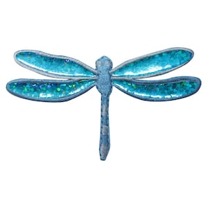 May include: A blue dragonfly patch with iridescent sequins on the wings. The dragonfly has a detailed embroidered design with a light blue body and wings outlined in a darker blue thread. The wings are filled with shimmering sequins.