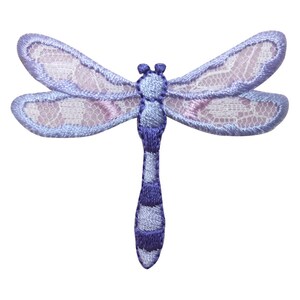 May include: A purple and white embroidered dragonfly with a lace-like design on its wings.