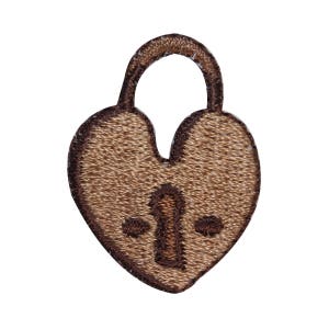 May include: A brown heart-shaped padlock with a keyhole and two small circles on the front. The padlock is made of a soft, textured fabric.