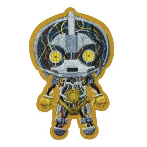 May include: An embroidered patch featuring a cartoon robot with a yellow background. The robot is made of metal and has a detailed design with visible wires and gears. The robot has large yellow eyes and a small mouth.