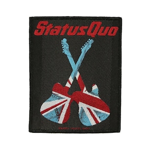 May include: Black patch featuring the text "Status Quo" in red above two crossed guitars. The guitars are red and blue, with a Union Jack design. The patch has a black border.