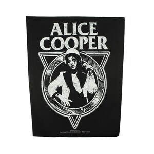 May include: Black and white iron-on patch featuring a portrait of Alice Cooper in a white suit and top hat, with the text "Alice Cooper" above the image. The image is surrounded by a circle with a triangle design.