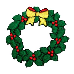 May include: A green Christmas wreath with a yellow bow and red berries.