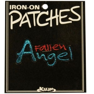 May include: Iron-on patch with the words "Fallen Angel" in blue and red glitter lettering. The patch is on a black background with the words "Iron-on Patches" at the top and "Kalan" at the bottom.