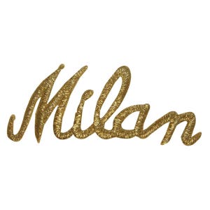 May include: Gold embroidered patch with the word "Milan" in a cursive script.