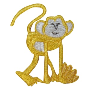 May include: Yellow embroidered monkey applique with a white face and a happy expression. The monkey is standing on its hind legs with its arms raised.