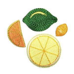May include: Four embroidered patches of citrus fruits: a green lime, a yellow lemon slice, an orange slice, and a yellow lemon wedge.