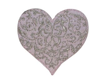 May include: A pink heart-shaped patch with a silver embroidered floral design.