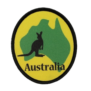 May include: A yellow and green embroidered patch featuring a black silhouette of a kangaroo in front of an outline of the continent of Australia. The text "Australia" is printed in black below the kangaroo.