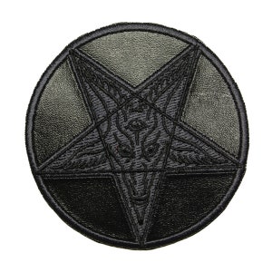May include: Black leather patch with an embroidered pentagram with a goat's head inside.