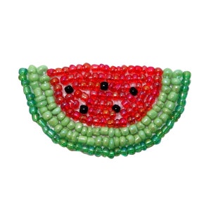 May include: A watermelon slice made of red, green, and black beads. The watermelon is a beaded craft.