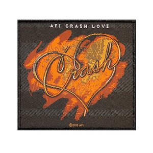 May include: AFI Crash Love patch with a black background and an orange heart with the word "Crash" written in a stylized font. The text "AFI Crash Love" is at the top of the patch and the text "©2010 AFI" is at the bottom.