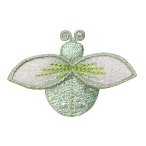 May include: A light green embroidered bee with white wings and green accents. The bee has a shiny, glittery finish.