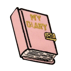 May include: Pink embroidered patch in the shape of a diary with the words "MY DIARY" in gold thread. The diary has a black border and a gold clasp. The pages are white and black.