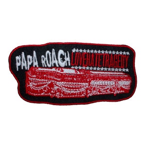 May include: Black embroidered patch with white text that reads "Papa Roach LoveHateTragedy" and a red and white embroidered image of a coffin with a red and white embroidered border.