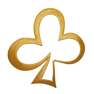 May include: A gold-colored club suit symbol, a common playing card symbol.