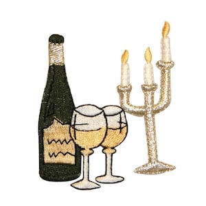 May include: Embroidered iron-on patch featuring a bottle of wine, two wine glasses, and a three-armed candelabra with three lit candles. The patch is in shades of gold, white, and green.