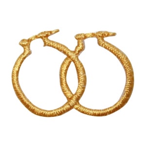 May include: A pair of gold hoop earrings made of woven thread.